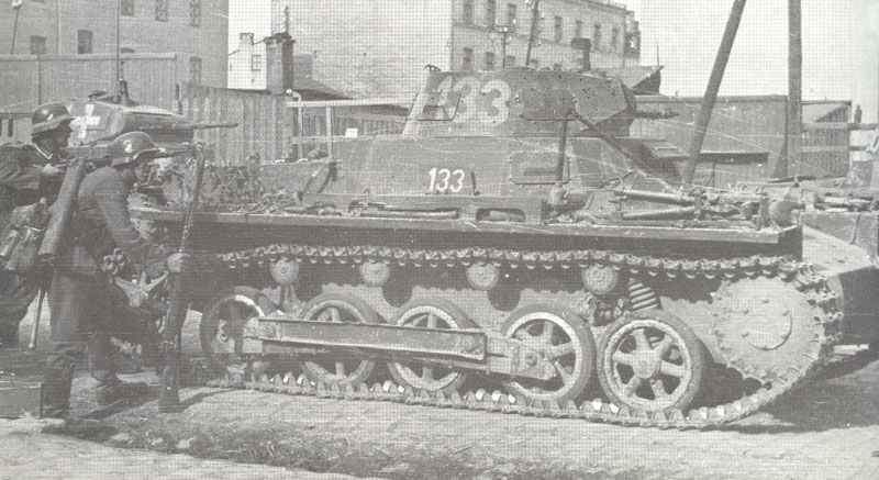 German infantry with Panzer I in street fighting.