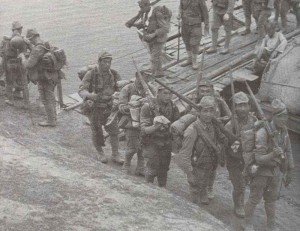 Japanese soldiers crossing a pontoon bridge in China