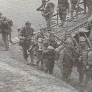 Japanese soldiers crossing a pontoon bridge in China