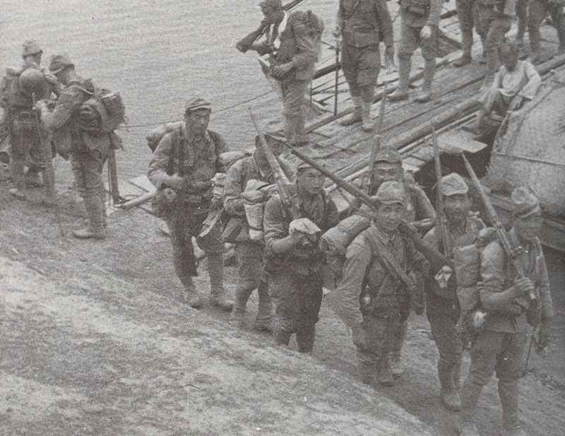 Japanese soldiers crossing a pontoon bridge in China