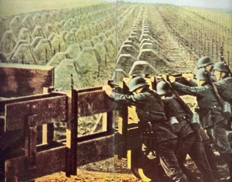 German soldiers are closing a door between the tank traps of the Siegfried Line