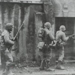 Us soldiers check houses at Metz for enemy 'stay-behinds'.