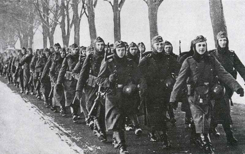 German infantry company is marching behind the Siegfried Line