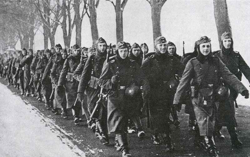 German infantry company is marching behind the Siegfried Line