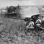 Russian T-34 tanks and fieldguns in action.