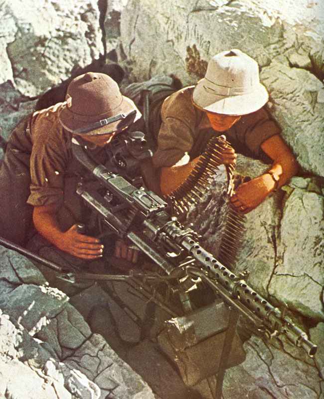 MG34 mounted on its tripod with long range sights for sustained fire role