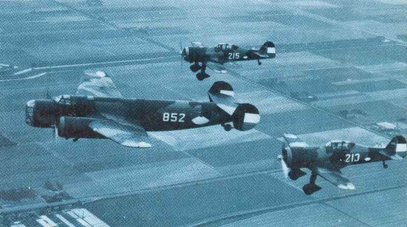 Dutch Armed Forces 3 ^D.XXI fighters escorting Fokker T.V heavy bomber