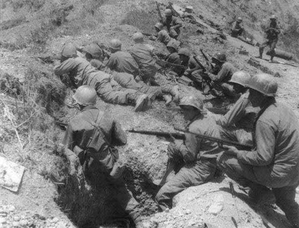 rifle platoon of US infantry atop the crest