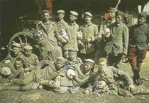 German POWs posing with one of their French guards for the camera.