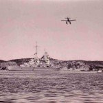 Ar 196 floatplane flying over heavy cruiser Admiral Hipper