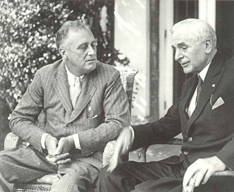 Roosevelt is talking with his foreign minister Cordell Hull.