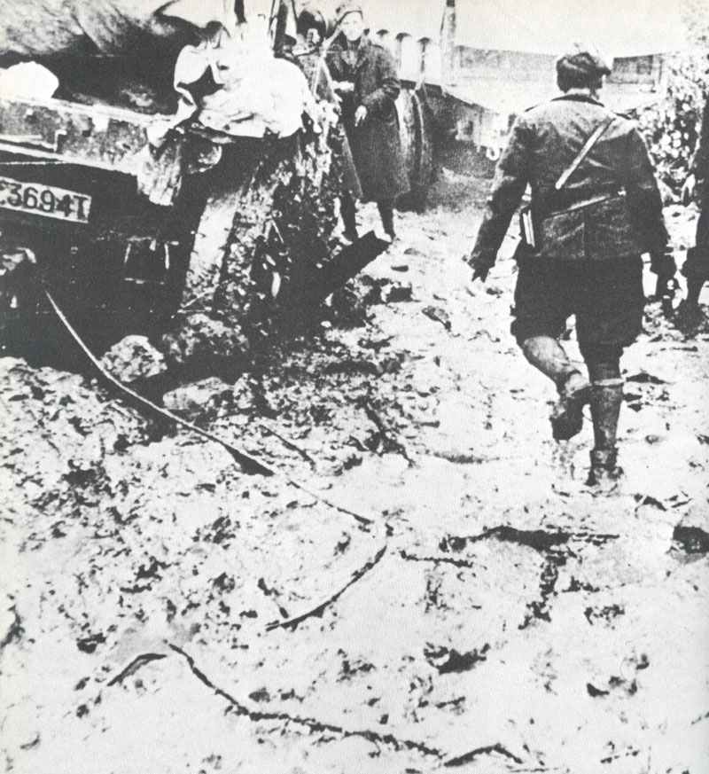 Greek soldiers in the autumn rain and deep mud