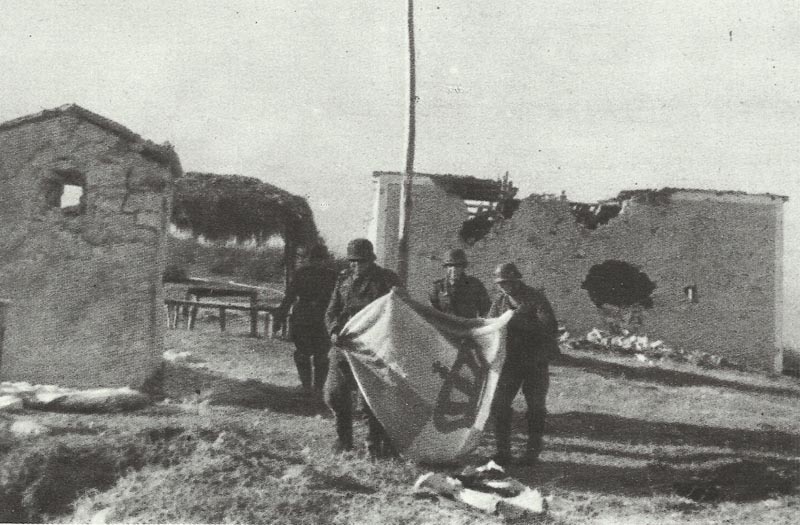 German soldiers hauled down a Greek war flag