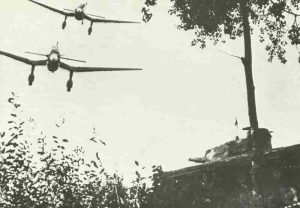 Stukas flying across a German Panzer IV tank.