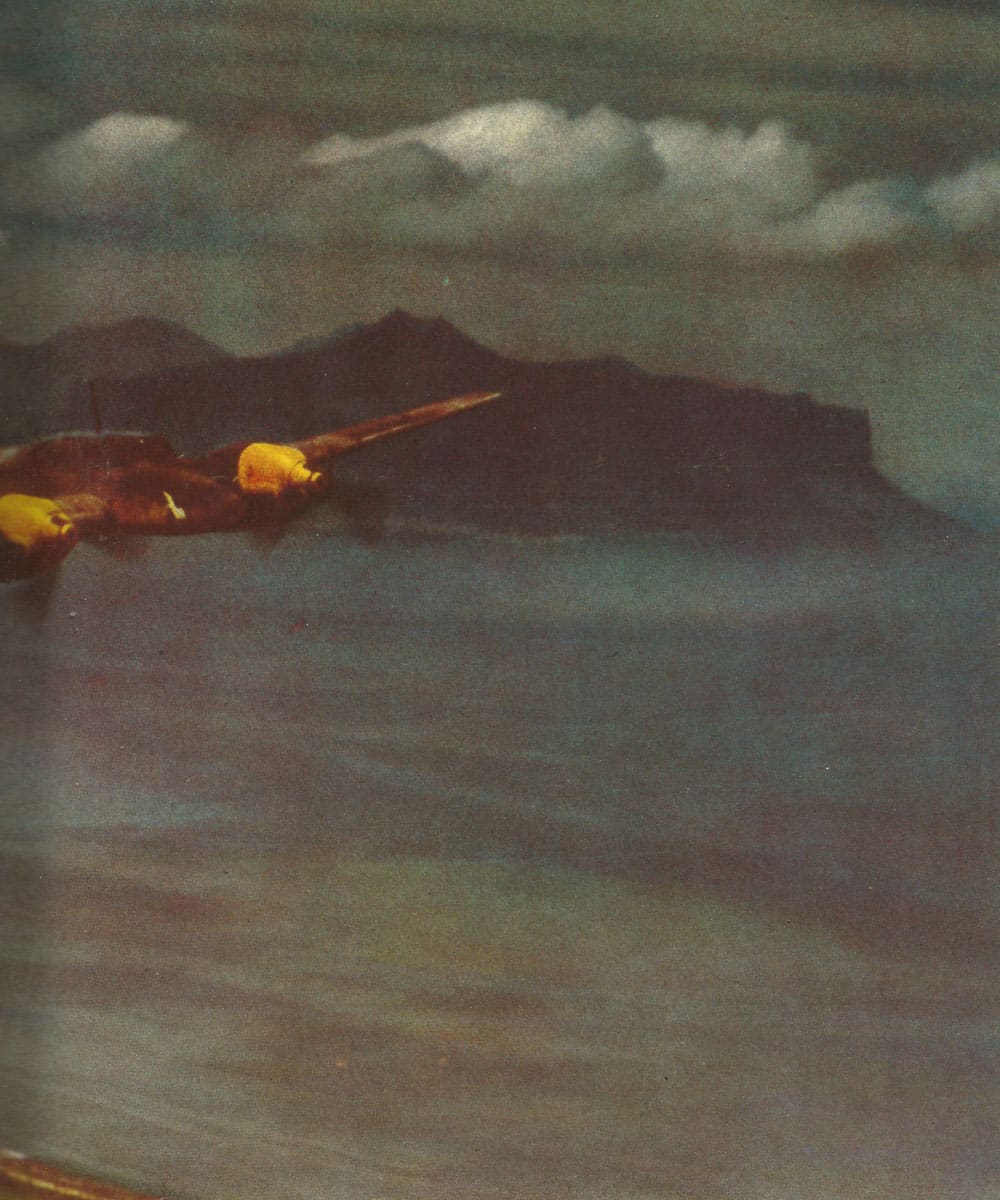 Me 110 heavy fighters fly off the African coast