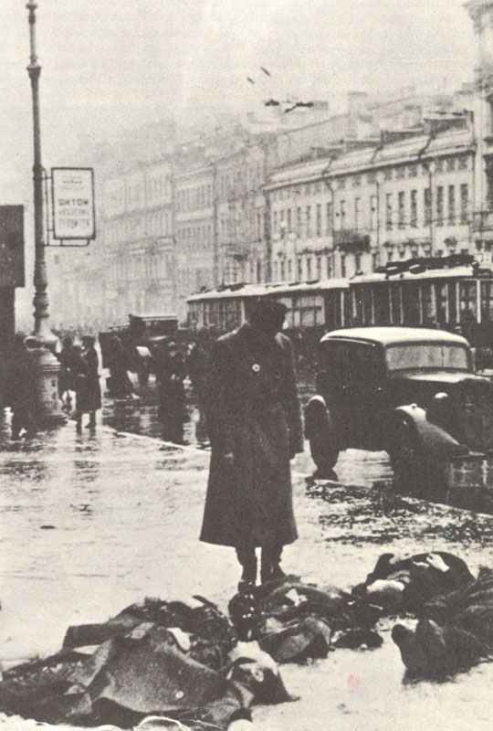 Starving civilians in the streets of Leningrad.