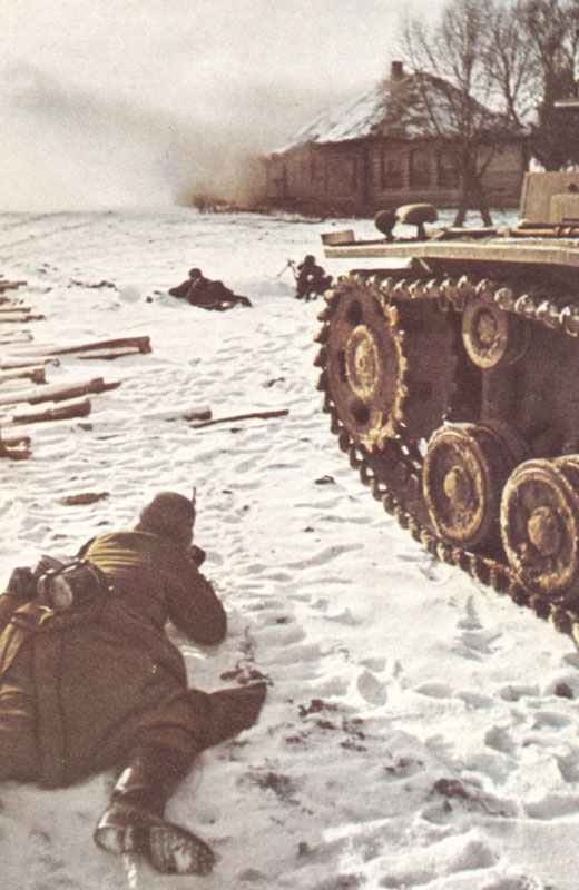 ^German infantry with tank support fighting for a village near Moscow.