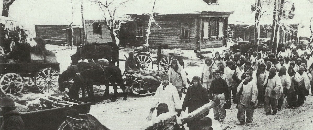 Soldiers of the Red Army move through a retaken village.