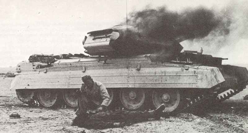First aid to a crew member of a knocked-out British Crusader tank