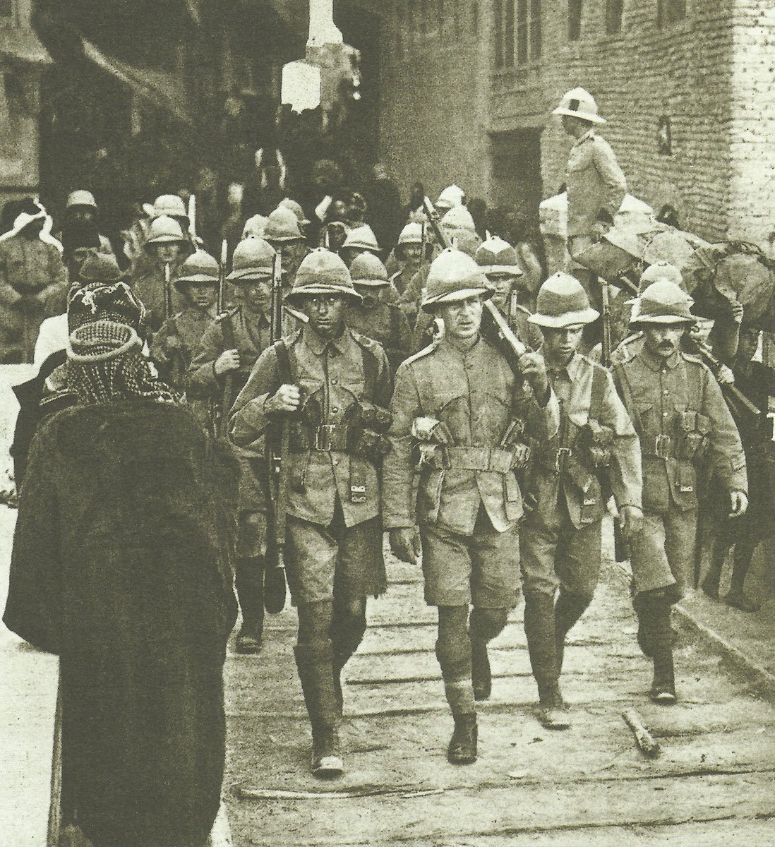 British troops march through the streets of Kut