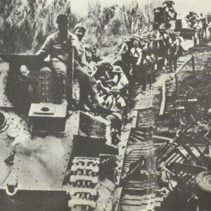Japanese light tanks cross a provisional bridge