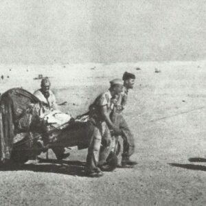 German paratroopers pull gun through the desert