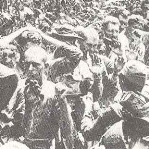US prisoners pass their captors on Corregidor.