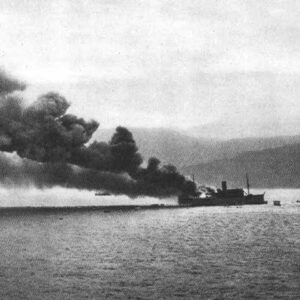 Allied transport ship burning in the port of Bougie