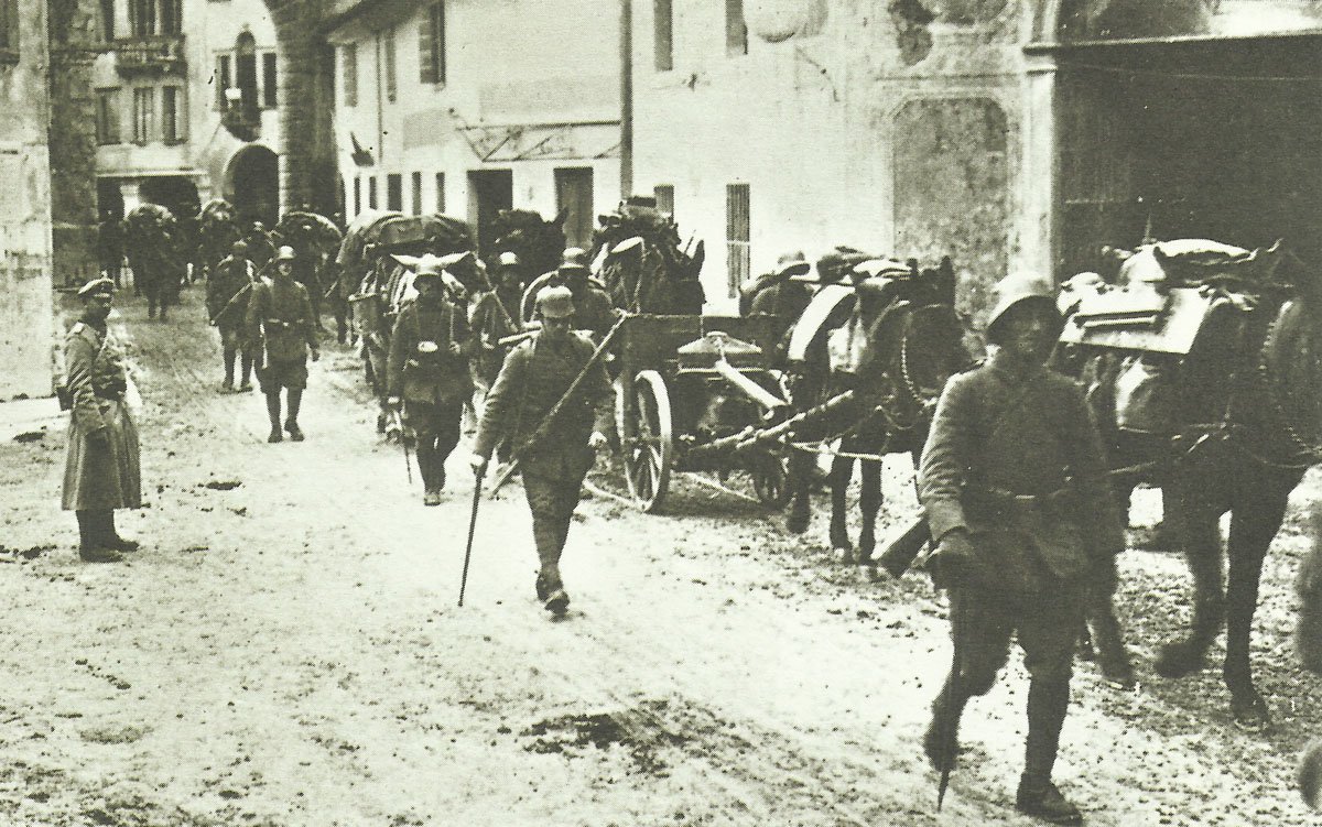 German troops move through a village in northern Italy