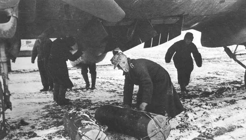 He 111 is loaded with parachute supply bombs