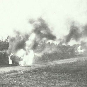 Italian armoured cars blazing on the road to Cap Bone.