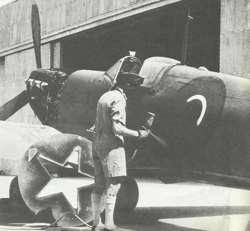 Painting the Red Star on a RAF Supermarine Spitfire at Abadan, Iran