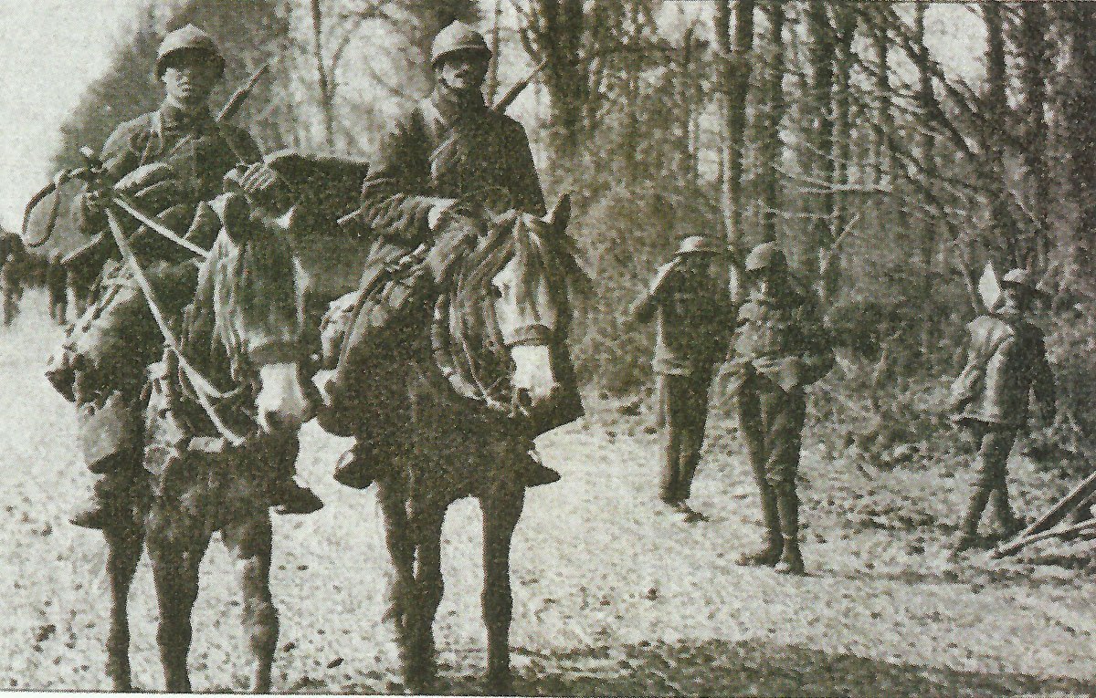 French cavalrymen pass British soldiers