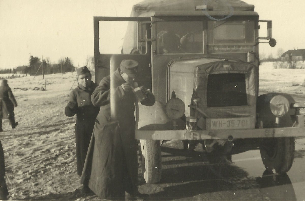 Soldiers of the 214th Infantry Division with truck