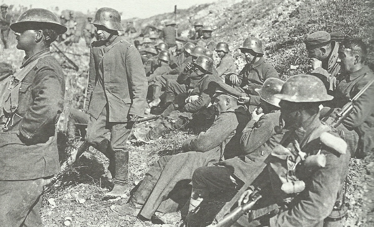 Canadian soldiers with captured Germans