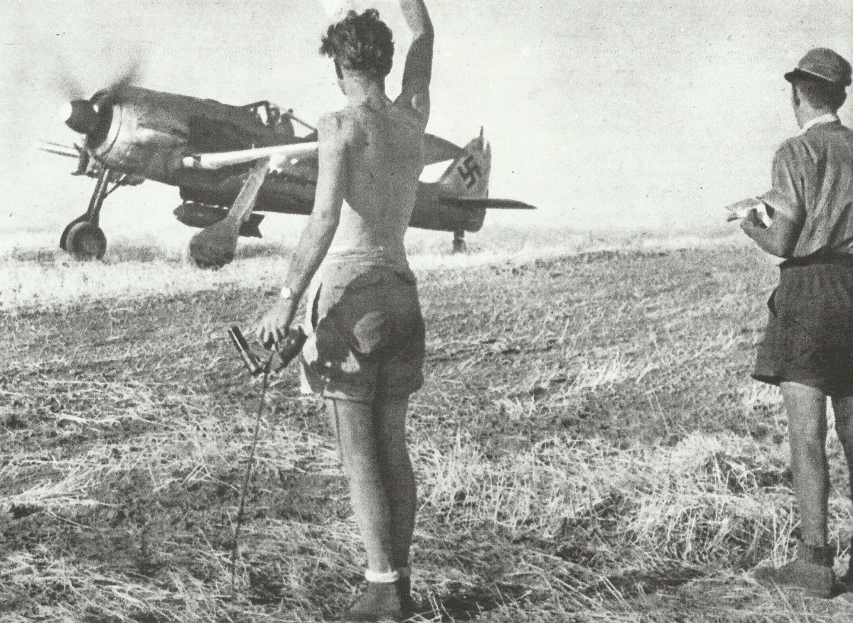 Fw 190 fighter-bomber rolls on a runway in southern Italy