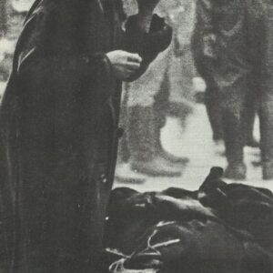 old woman with the rest of her belongings after air raid