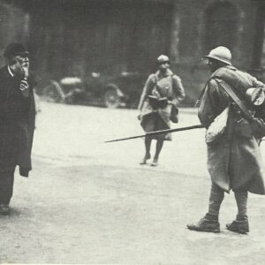 French soldier threatens an old man