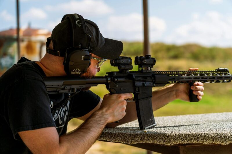 How WWII Rifle Design Influenced Modern AR-15 Development 3 Man shooting with a rifle at an outdoor range
