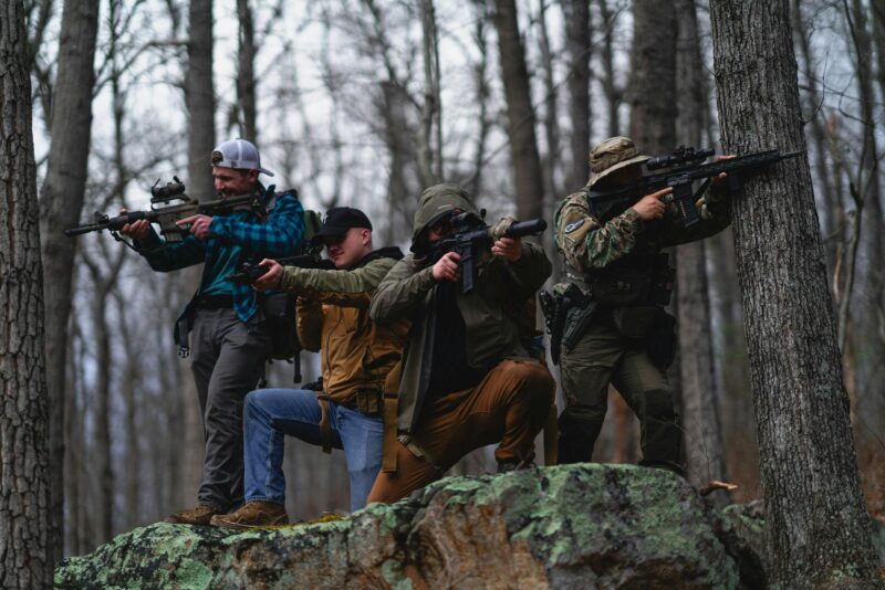 How WWII Rifle Design Influenced Modern AR-15 Development 3 Group of men with guns in the woods