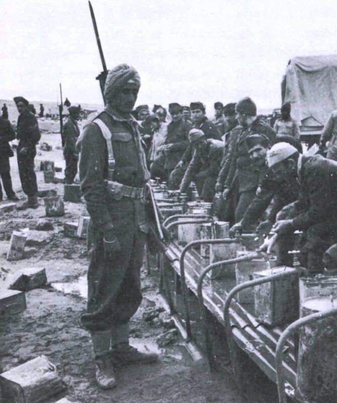East African Campaign 1940-41 7 ondian soldier guarding italians